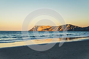 Beautiful seaside of ocean and crag at sunset, Cantabria, Spain