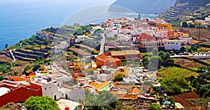 Beautiful seaside valley with colorful canarian coastal town, hazy sea shore and mountains -  La Puntilla, La Gomera photo