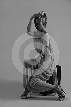 Beautiful seated woman in monochrome