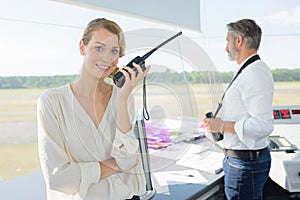 Beautiful security guard using walkie talkie