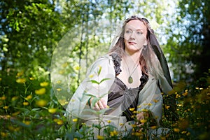 Beautiful seductive dryad. Pagan spirit of the forest. Portrait of beautiful dryad. Fairy who loves nature in beautiful