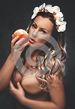 Beautiful seductive woman with apple