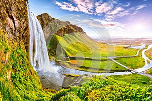 Beautiful  Seljalandsfoss waterfall in Iceland during the sunset