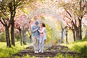 Beautiful senior couple in love outside in spring nature.