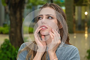 Beautiful sensual woman with clean skin, natural make-up on summer background. Portrait of beautiful girl with perfect