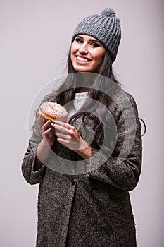 Beautiful sensual woman posin with donuts