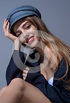 Beautiful sensual young woman in fashion cap hat, close up studio portrait. Beautiful model, sexy girl face. Fashion and