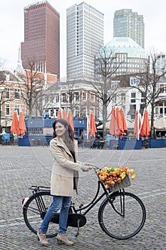 Beautiful sensuality elegance lady walking beside her bicycle