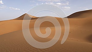 Beautiful serene desert sand dunes landscapes in the Sahara desert, Mhamid, Erg Chigaga, Morocco.