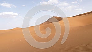 Beautiful serene desert sand dunes landscapes in the Sahara desert, Mhamid, Erg Chigaga, Morocco.