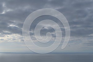 Beautiful serene overcast and tranquil sea and sky background.