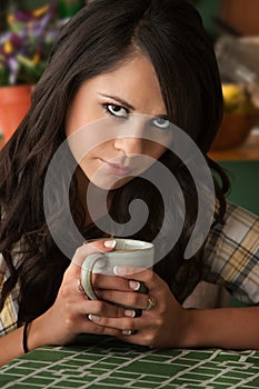 Beautiful Serious Latina Woman with Cofee or Tea