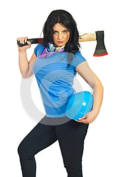 Beautiful serious worker woman with ax