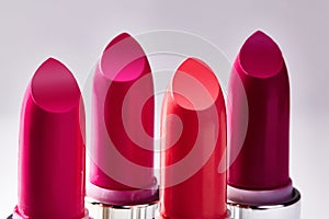 Beautiful set of lipsticks in red colors. Beauty cosmetic collection. Fashion trends in cosmetics with bright lips