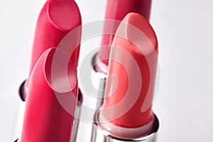 Beautiful set of lipsticks in red colors. Beauty cosmetic collection. Fashion trends in cosmetics with bright lips