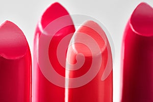 Beautiful set of lipsticks in red colors. Beauty cosmetic collection. Fashion trends in cosmetics with bright lips