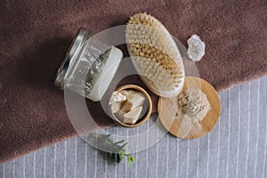 Beautiful set of natural organic ayurvedis homemade cosmetic products for personal body care: massage brush, shea and coconut butt