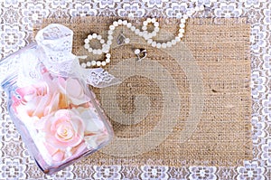 Beautiful set of wedding accessories, white shoes, perfume, pearl necklace and earrings.