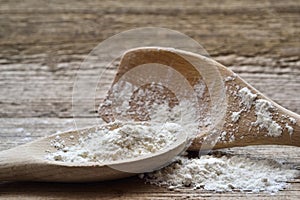 Beautiful setup with flour and two wooden spoons