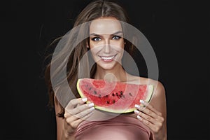 Beautiful brunette woman eating watermelon on a white background, healthy food, tasty food, organic diet, smile healthy, blac