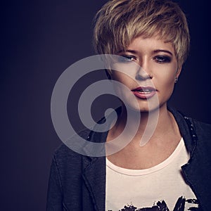 Beautiful cocky woman with short bob blond hairstyle in fas photo