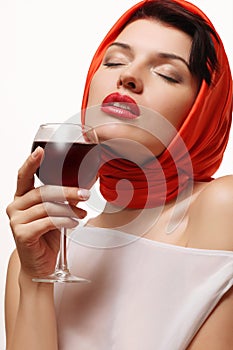 Beautiful and girl with a glass of red wine in hand