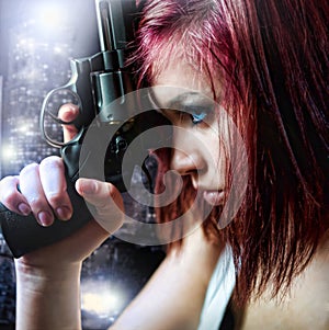 Beautiful girl holding gun