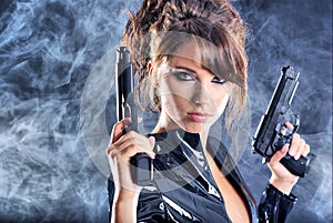 Beautiful girl holding gun