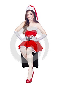 Beautiful girl wearing santa claus clothes isolated on whit