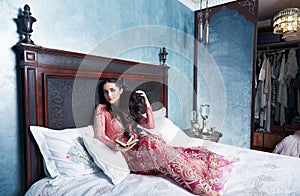 Beautiful woman bed harem bedroom dress clothes fashion photo