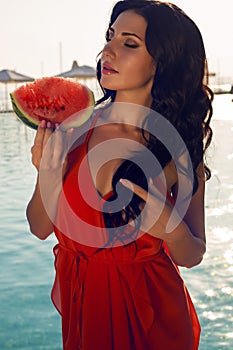 Beautiful woman with dark hair with watermelon