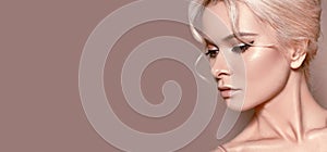 Beautiful sexy Woman with luxury Make-up. Girl with blond hair on beige background. Style for Womans Day or Valentines