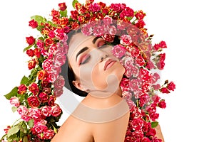 Beautiful woman with red roses flower on head