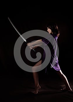 Beautiful woman with samurai sword. woman with katana