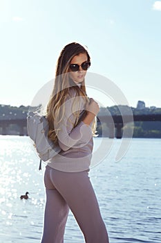 Beautiful woman walk on beach water wear knitwear