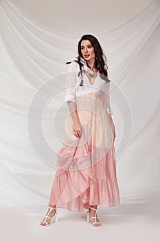 Beautiful sexy woman wear light pink multicolor dress summer collection silk casual style tanned body brunette hair beautiful face