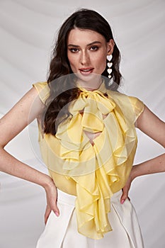 Beautiful sexy woman wear yellow silk blouse color short summer collection cotton casual style tanned body brunette hair beautiful