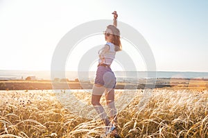 Beautiful sexy young woman smiling on beautiful landscape in sunset time