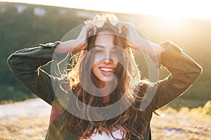 Beautiful sexy young woman smiling on beautiful landscape in sunset time