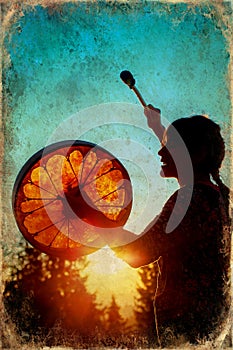 Beautiful shamanic girl playing on shaman frame drum in the nature, old photo effect.