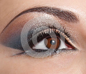 Beautiful shape of female eye with golden-brown