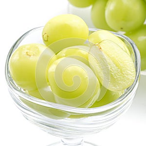 Beautiful Shine Muscat green grape in a glass cup isolated on white background