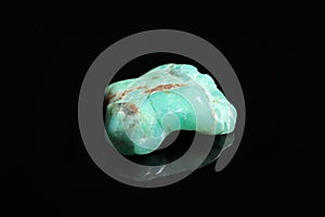 Beautiful shiny chrysoprase gemstone on background