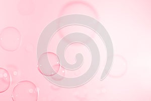 Beautiful shiny transparent soap bubbles float on pink background. Abstract, Celebration, Natual fresh summer background.