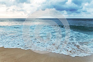 Beautiful shoreline at tropical sandy beach in Oahu island