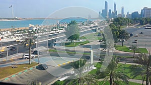 Beautiful shot of Abu Dhabi city skyline towers, corniche street and beach