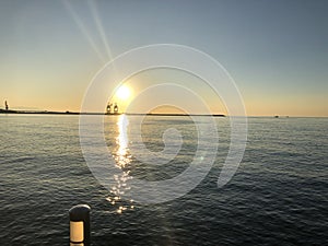 Beautiful shot of a big harbor silhouette on an orange sunset background