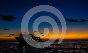 Beautiful shot of a big sailing yacht near Revillagigedo Islands during a sunrise in Mexico