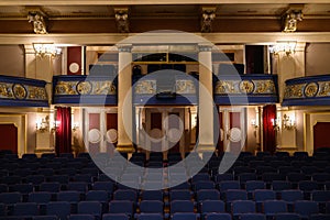 Beautiful shot of the blue seats and unique interior of an empty theatre