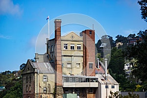 Beautiful shot of a building in South Hobart in Australia with the Australian flag on the roof